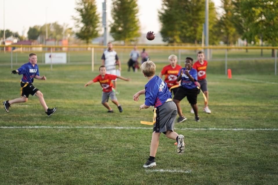 Kids throwing football